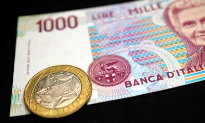 Banconota da 1000 lire con una moneta da 500 lire